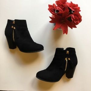 Black booties with fringe zipper